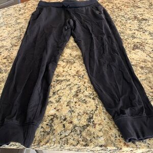 Size 8 Black Lululemon joggers in used fair condition
